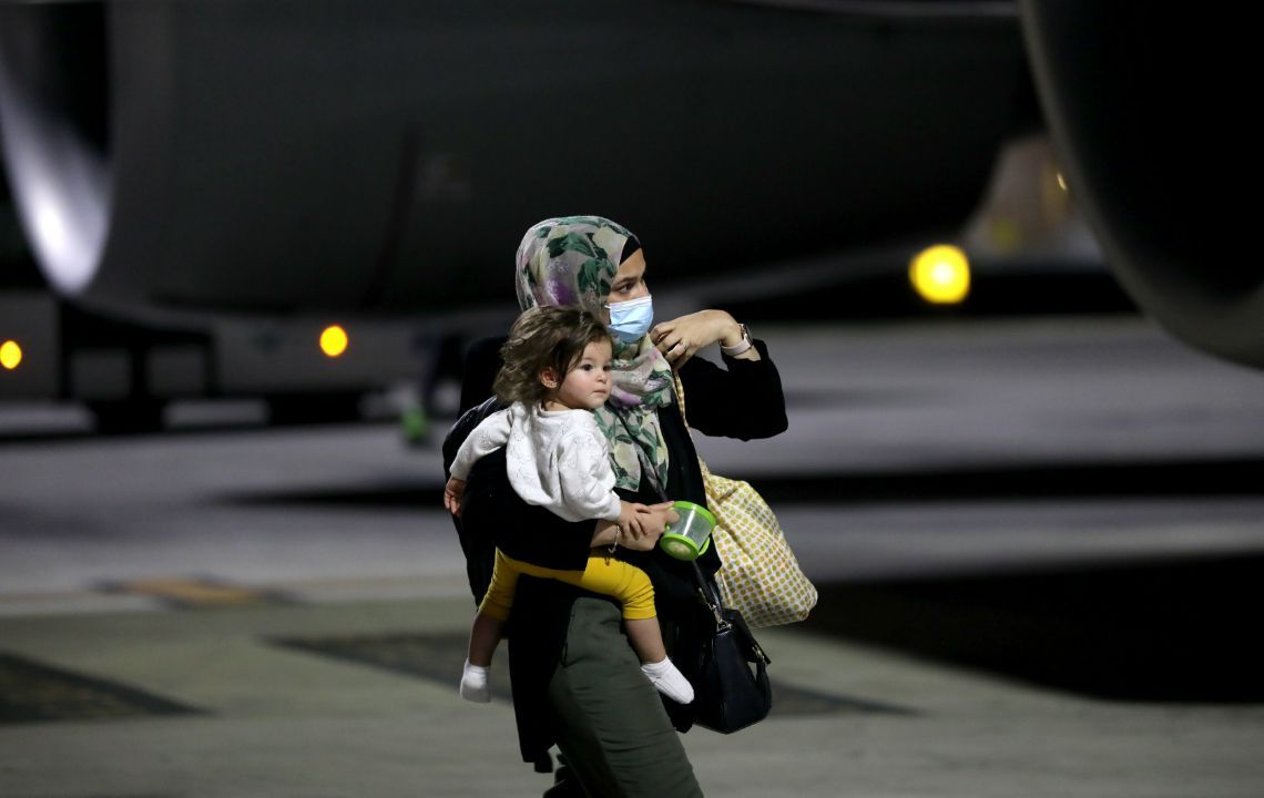 How did Qatar help reunite Afghan children with their families?